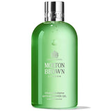 A green bottle of Molton Brown London Eucalyptus Body Wash, 10 oz / 300 ml, with a flip-top cap.